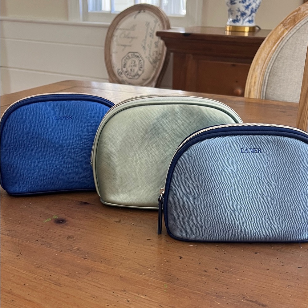 Lamer cosmetic bags in pristine condition